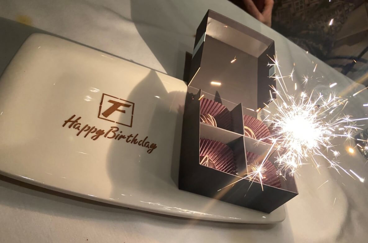 The birthday dessert at Fleming's Steakhouse features a box of chocolates and a sparkler