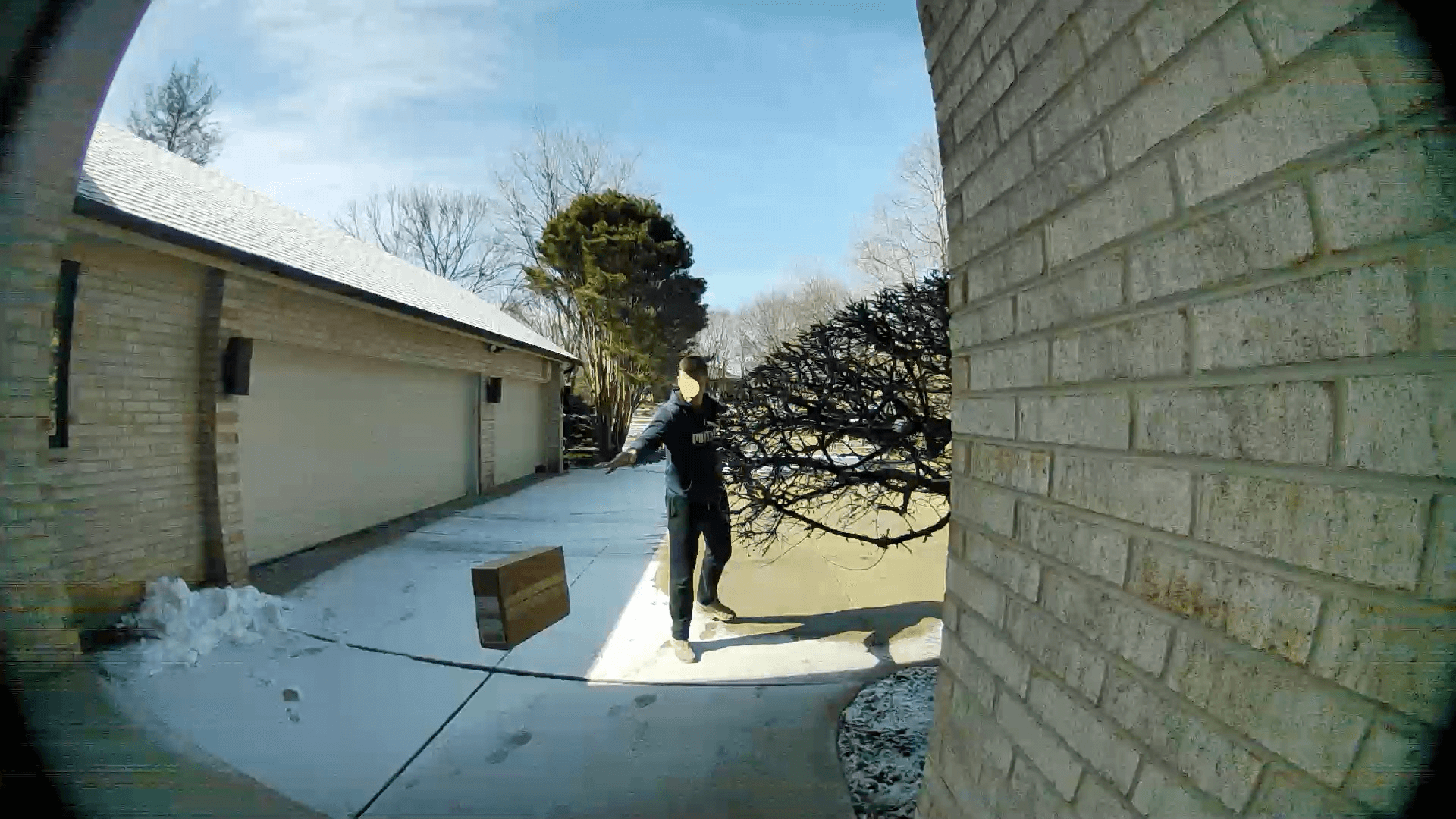 A delivery man throws a package at the author's front door