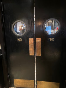 Two doors with yes and no written on them