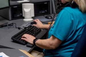 contact center rep on phone and computer