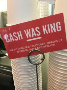 A sign reads "Cash Was King"