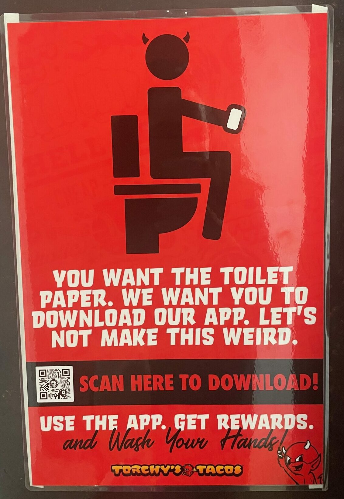 A restaurant asks patrons to choose between toilet paper and downloading their app