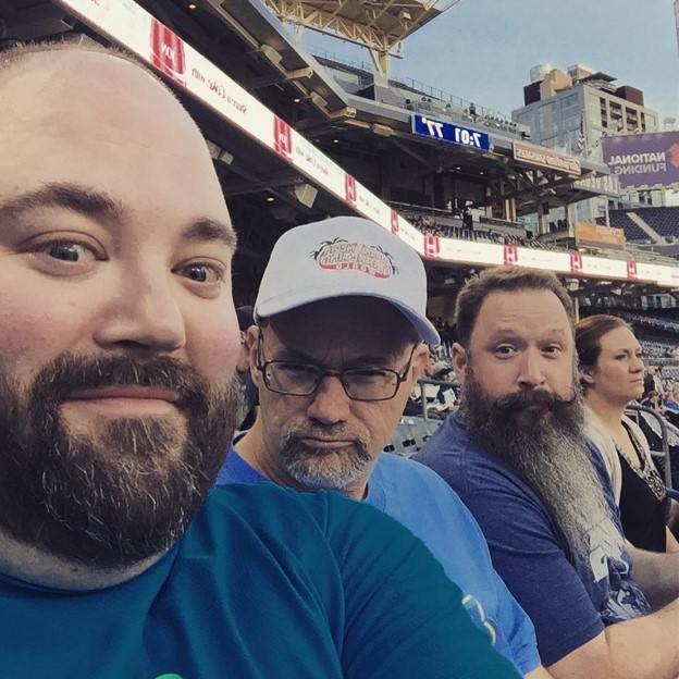 Phil Mershon enjoys memorable experiences with friends Erik Fisher, Jeff Sieh, and Joanne Watt at a San Diego Padres game.