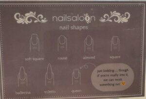 A sign in The Nail Saloon identifies different nail styles, such as round, almond, and square. Then there's one called "queen" where the nail has points at the top like a crown, with a note that says "just kidding... though if you're really into it we can work something out." This is a great example of a salon customer experience infusing some humor.